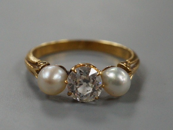 A yellow metal, cultured pearl and diamond set three stone ring, size L, gross weight 3 grams